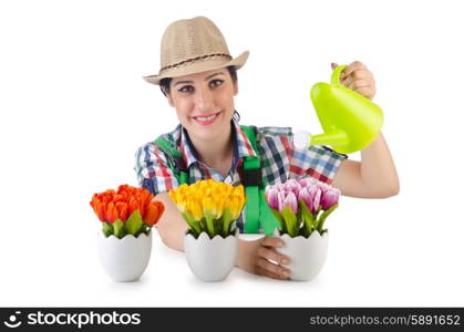 Girl watering plants on white