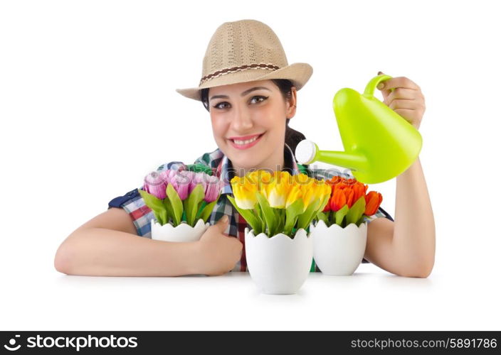 Girl watering plants on white