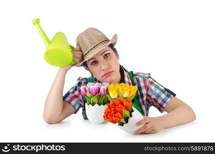 Girl watering plants on white