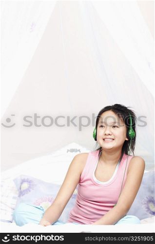 Girl wearing headphones listening to music