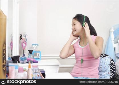 Girl wearing headphones listening to music