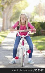 Girl Wearing Rucksack Cycling To School