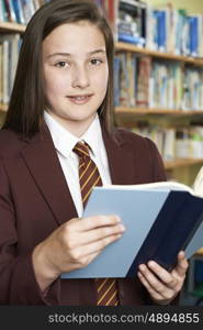 Girl Wearing School Uniform Reading Book In Library