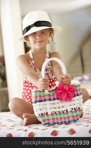 Girl Wearing Swimming Costume With Straw Hat And Bag