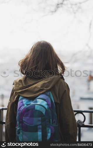 girl with a backpack on the observation deck 