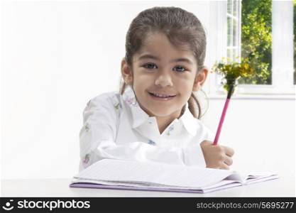 Girl with a book and pencil