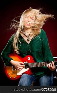 girl with a guitar on a dark red background