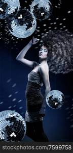 girl with a lot of curly hair and disco balls