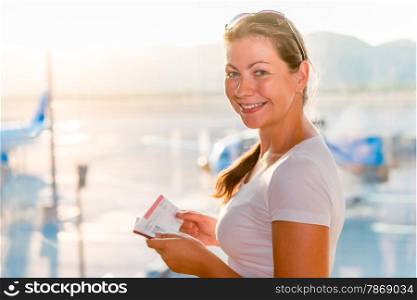 girl with a passport and a ticket waiting for the plane