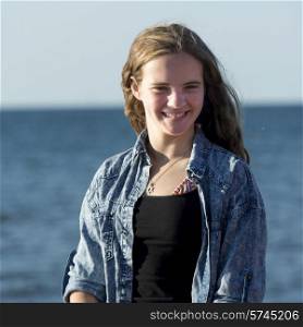 Girl with Atlantic Ocean in background, Cavendish Beach, Green Gables, Prince Edward Island, Canada