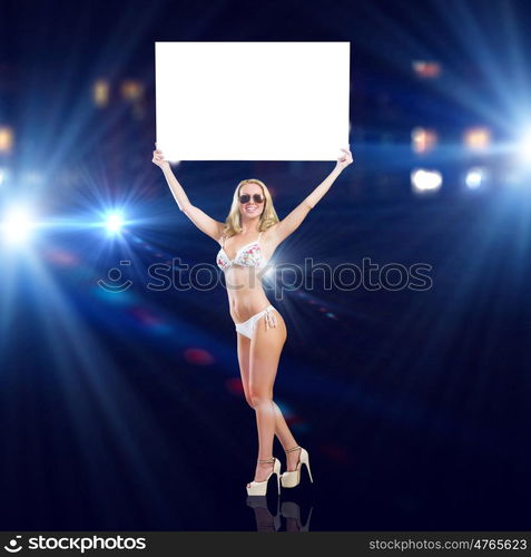 Girl with banner. Attractive girl in swimming suit holding white blank banner above head