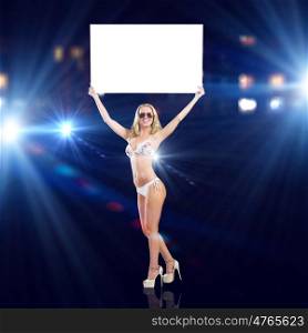 Girl with banner. Attractive girl in swimming suit holding white blank banner above head