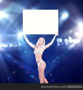 Girl with banner. Attractive girl in swimming suit holding white blank banner above head