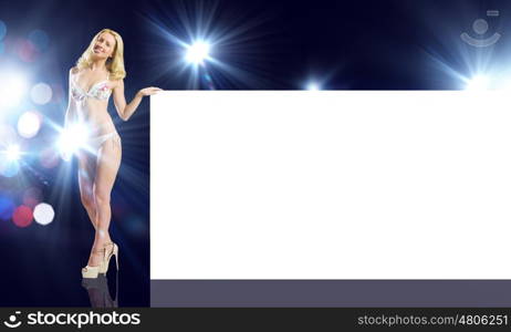 Girl with banner. Attractive girl in swimming suit with white blank banner. Place for text