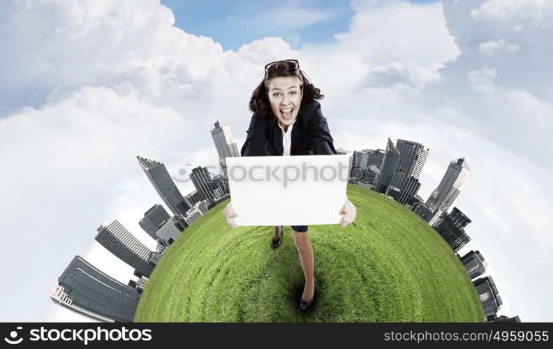 Girl with banner. Top view of excited businesswoman holding white blank banner. Place for text