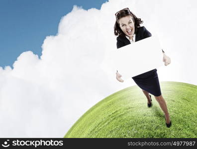 Girl with banner. Top view of excited businesswoman holding white blank banner. Place for text