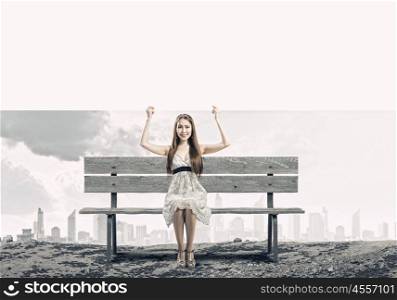 Girl with banner. Young asian woman sitting on bench with blank banner
