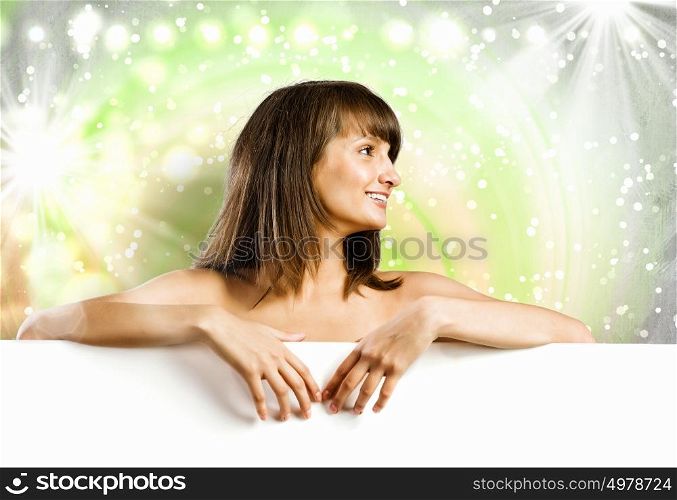 Girl with banner. Young naked girl holding white blank banner. Place for text