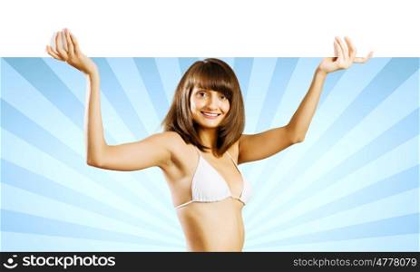 Girl with banner. Young pretty girl in bikini holding blank banner