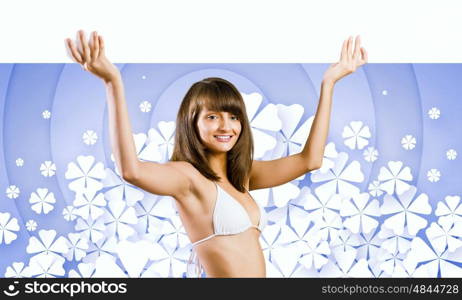 Girl with banner. Young pretty girl in bikini holding blank banner