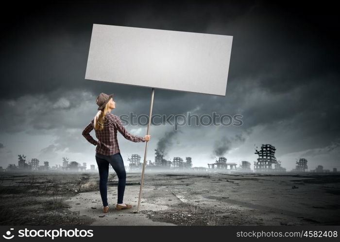 Girl with banner. Young woman in casual carrying white blank banner