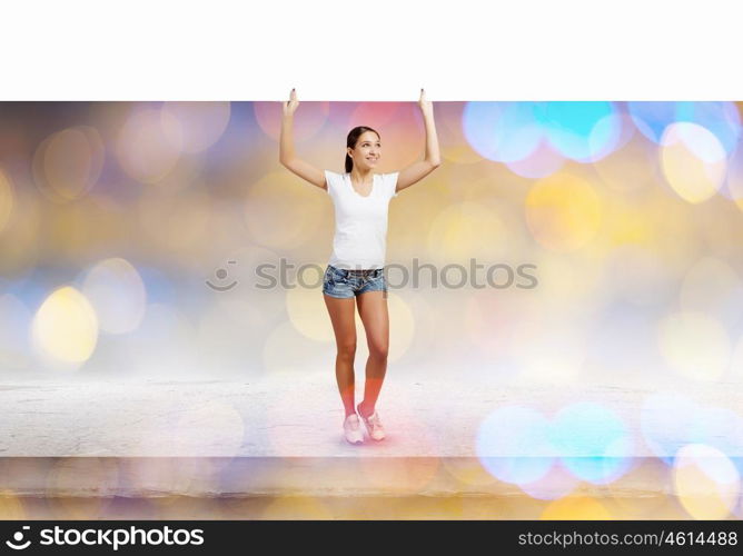 Girl with banner. Young woman in casual holding white blank banner. Place for text