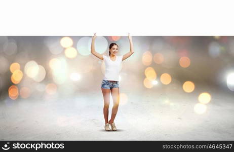 Girl with banner. Young woman in casual holding white blank banner. Place for text