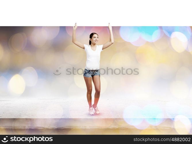 Girl with banner. Young woman in casual holding white blank banner. Place for text