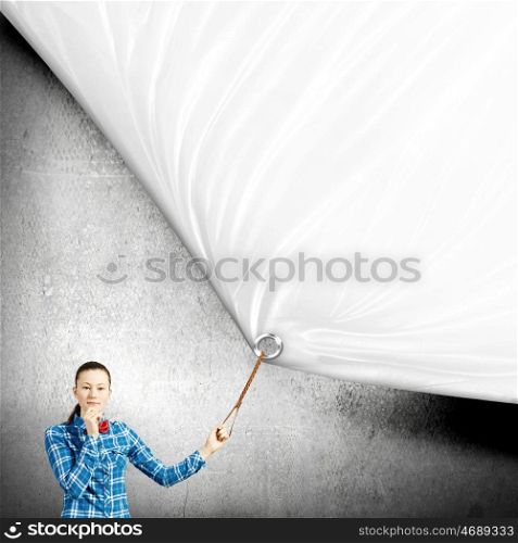 Girl with banner. Young woman in casual pulling white blank banner