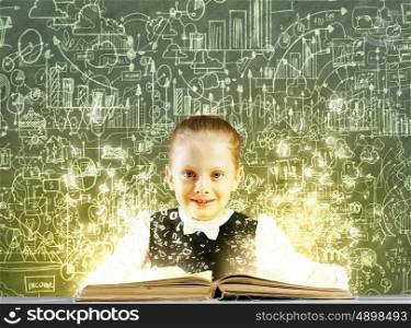 Girl with book. Cute school girl with opened book and sketches at background