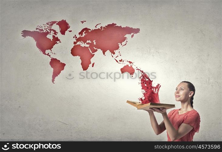Girl with book. Young emotional woman in red dress with book in hands