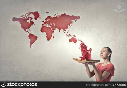 Girl with book. Young emotional woman in red dress with book in hands