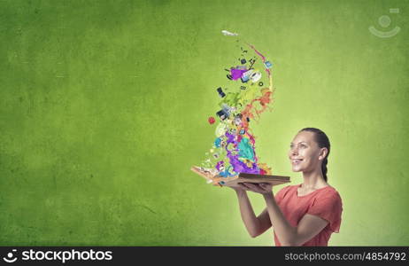 Girl with book. Young emotional woman in red dress with book in hands