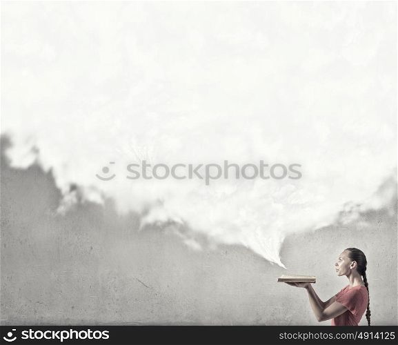 Girl with book. Young emotional woman in red dress with book in hands