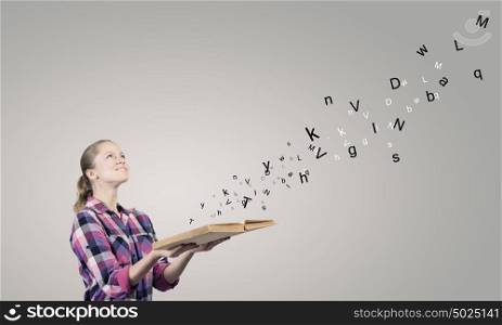 Girl with book. Young girl in casual holding book in hands