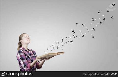 Girl with book. Young woman in casual with book in hands