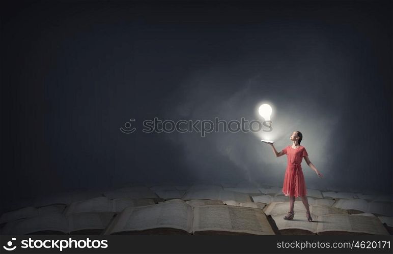 Girl with book. Young woman in red dress with book in hand