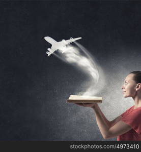 Girl with book. Young woman in red dress with book in hand