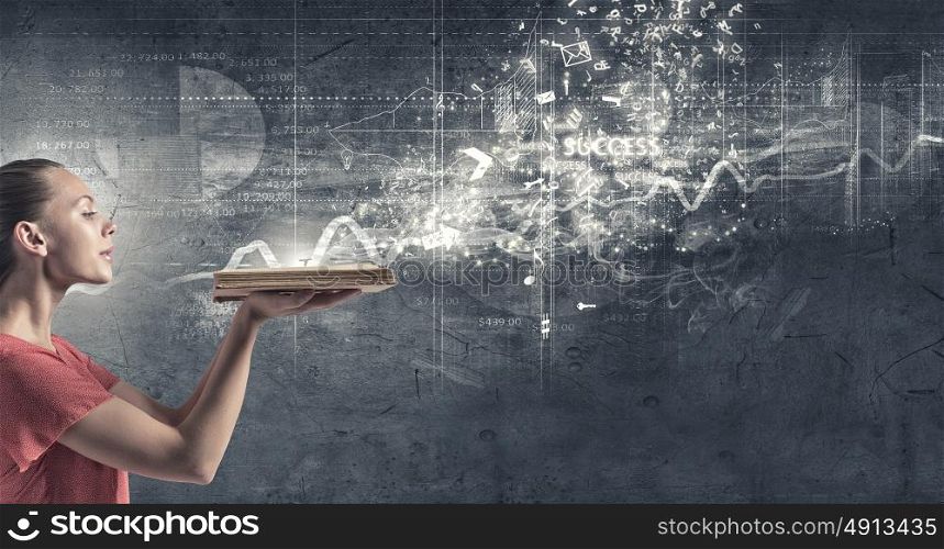 Girl with book. Young woman in red dress with opened book in hand