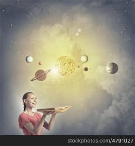 Girl with book. Young woman with book exploring planets of sun system