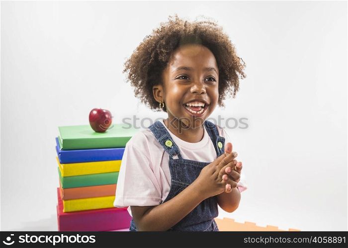 girl with books laughing studio