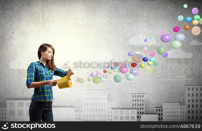 Girl with bucket. Young pretty woman with yellow bucket in hands