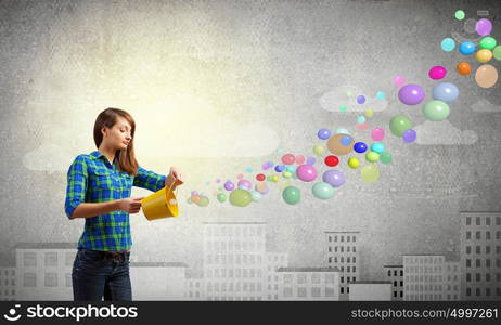 Girl with bucket. Young pretty woman with yellow bucket in hands