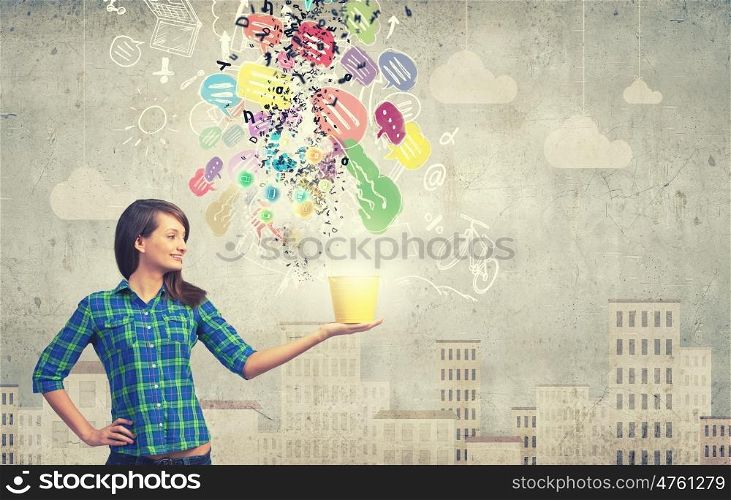 Girl with bucket. Young woman in casual with yellow bucket in hands