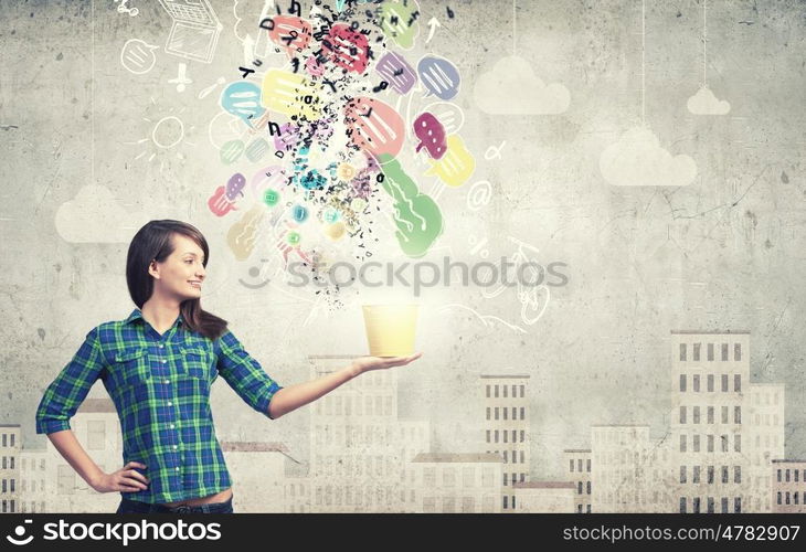 Girl with bucket. Young woman in casual with yellow bucket in hands