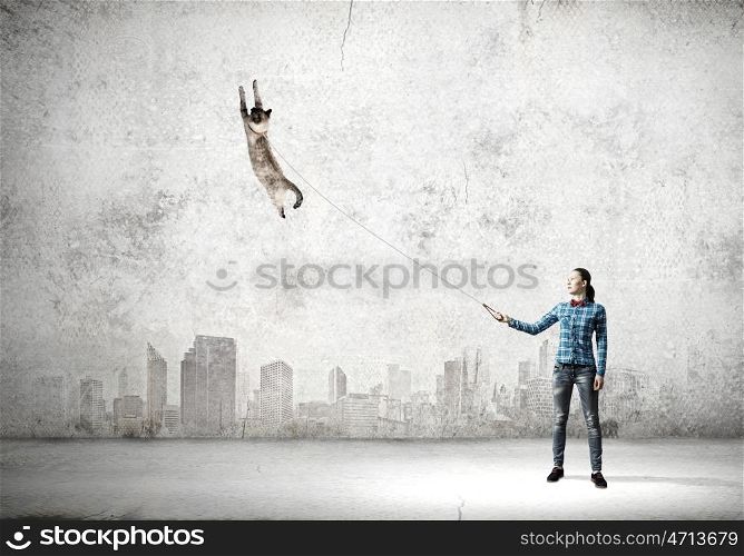 Girl with cat. Young girl in casual with cat on lead
