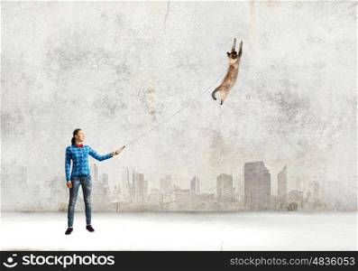 Girl with cat. Young girl in casual with cat on lead