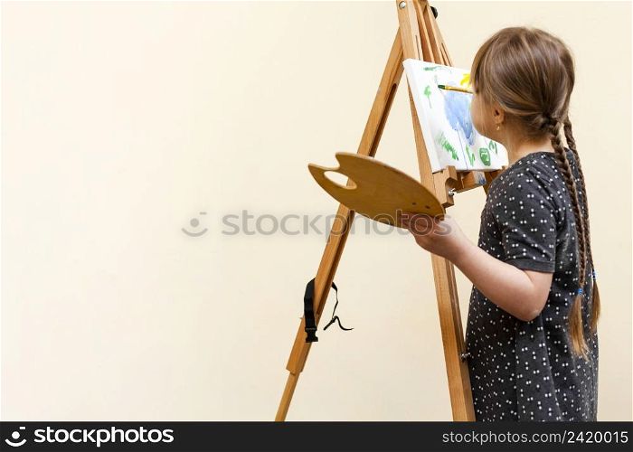 girl with down syndrome painting with copy space