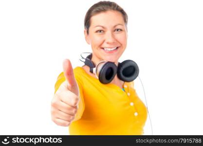 girl with headphones shows satisfaction