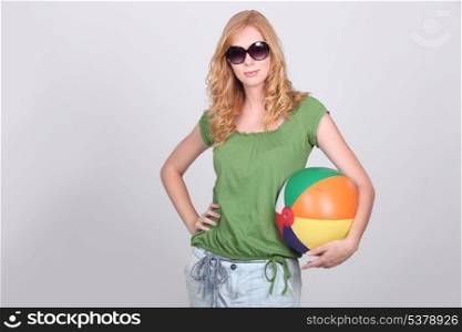 Girl with inflatable beach ball